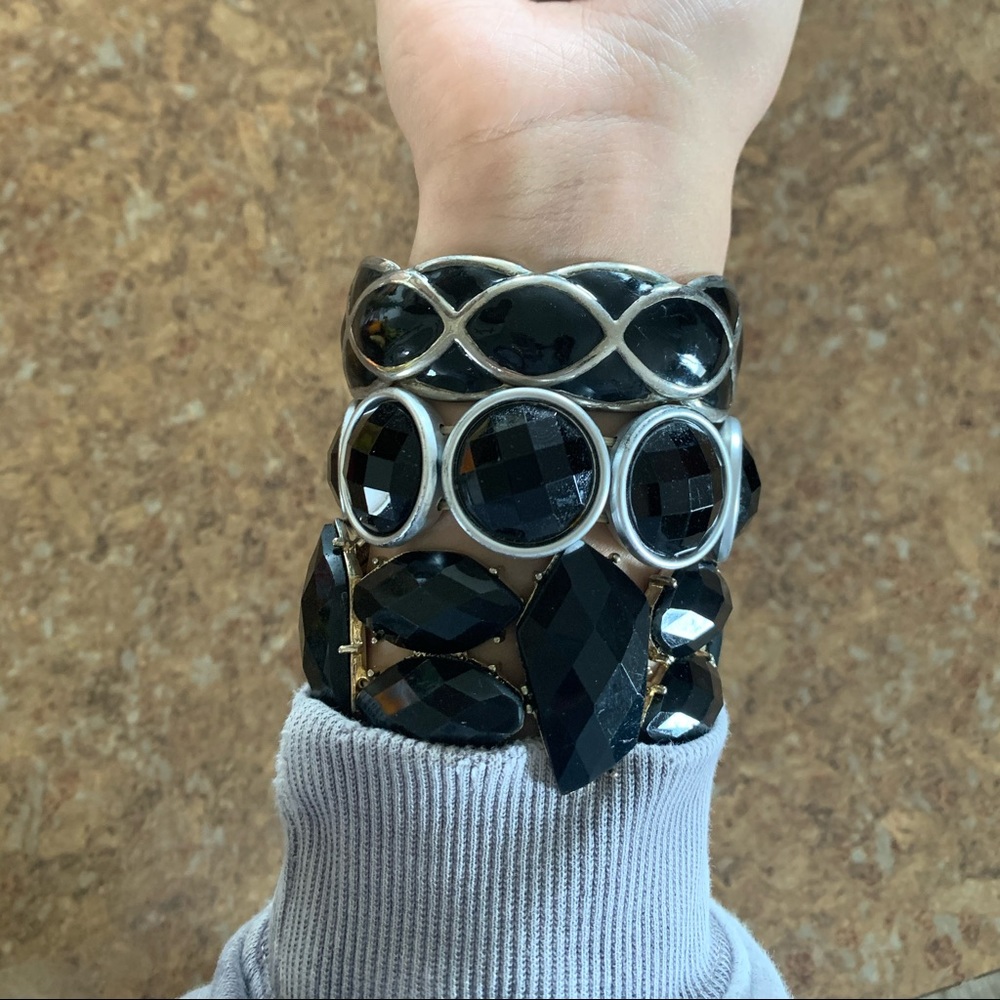 3 black bracelets